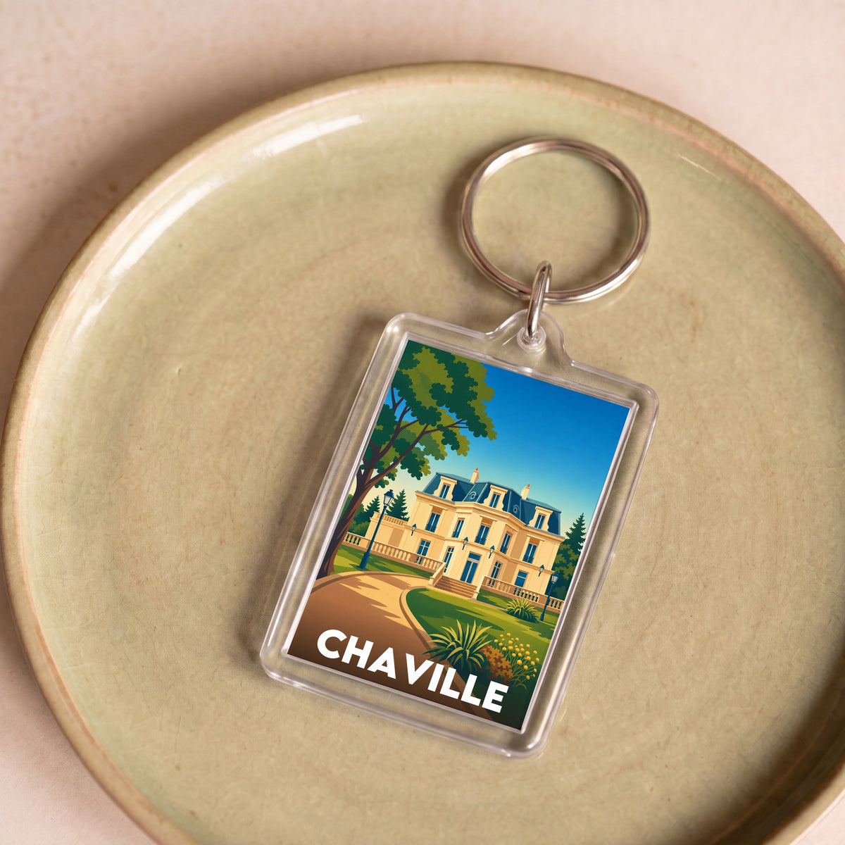 Porte-clés souvenir de la ville de Chaville avec une illustration stylisée.