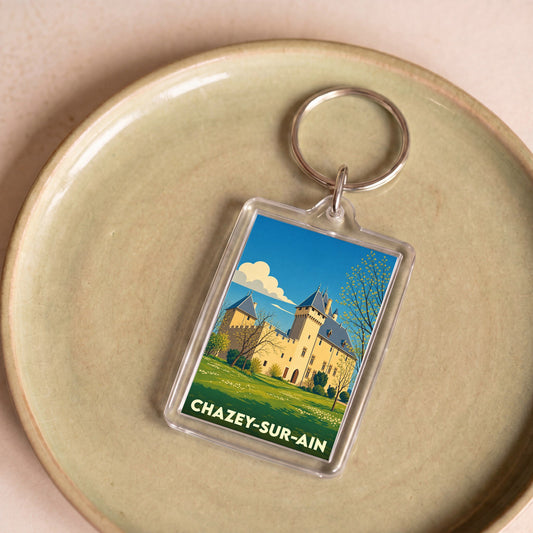 Porte-clés souvenir de la ville de Chazey-sur-Ain avec une illustration stylisée de son château.