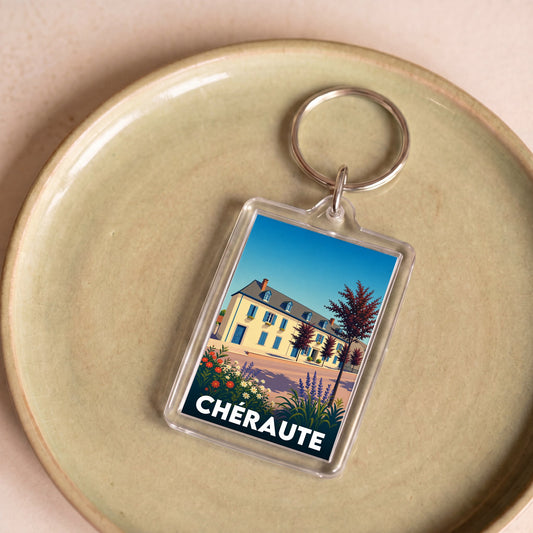 Porte-clés souvenir de la ville de Chéraute avec une illustration stylisée d'un bâtiment.