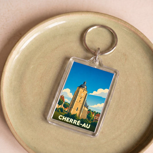 Porte-clés souvenir de la ville de Cherré-Au avec une illustration stylisée de son église.