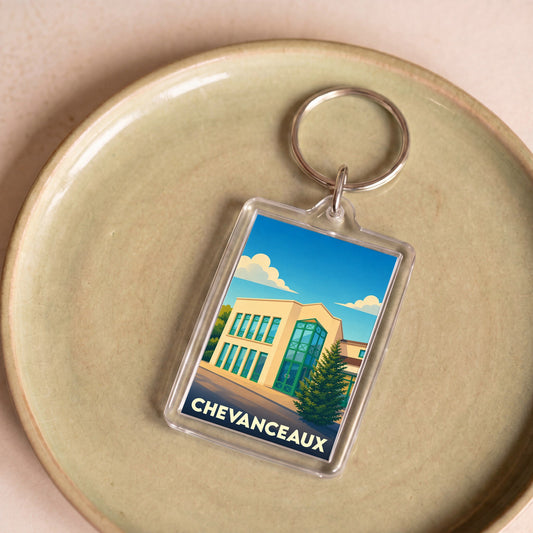 Porte-clés souvenir de la ville de Chevanceaux avec une illustration stylisée.