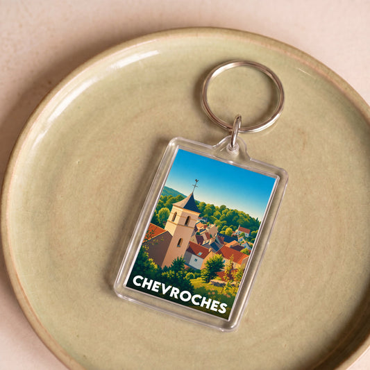 Porte-clés souvenir de la ville de Chevroches avec une illustration stylisée.