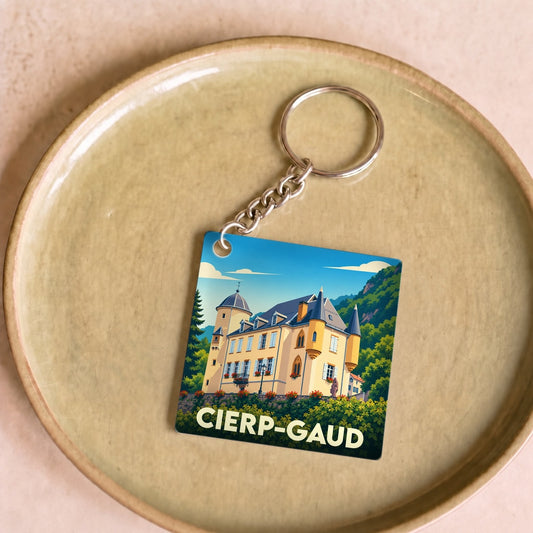 Porte-clés souvenir de la ville de Cierp-Gaud avec une illustration stylisée de son château.