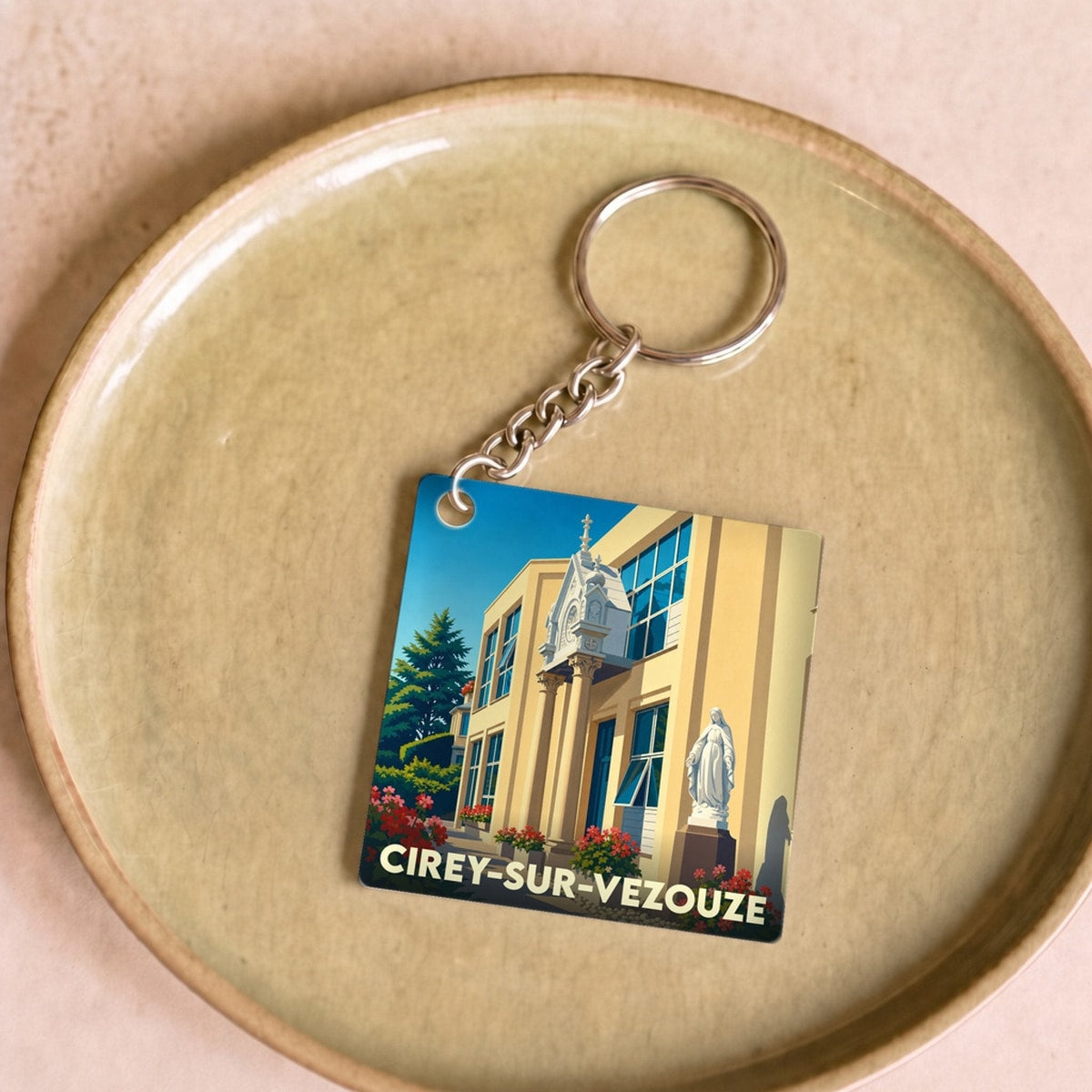 Porte-clés souvenir de la ville de Cirey-sur-Vezouze avec une illustration stylisée.