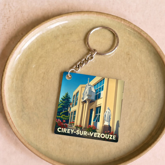 Porte-clés souvenir de la ville de Cirey-sur-Vezouze avec une illustration stylisée.