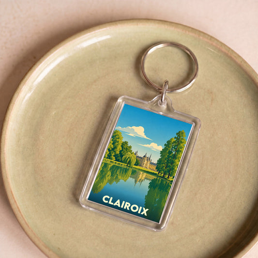 Porte-clés souvenir de la ville de Clairoix avec une illustration stylisée.