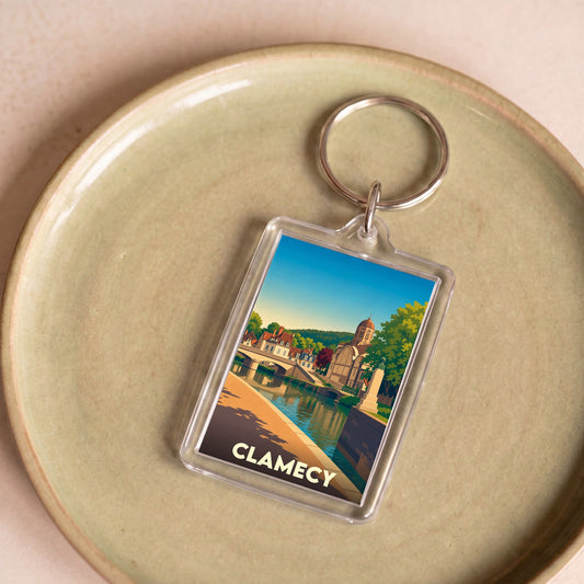 Porte-clés souvenir de la ville de Clamecy avec une illustration stylisée.