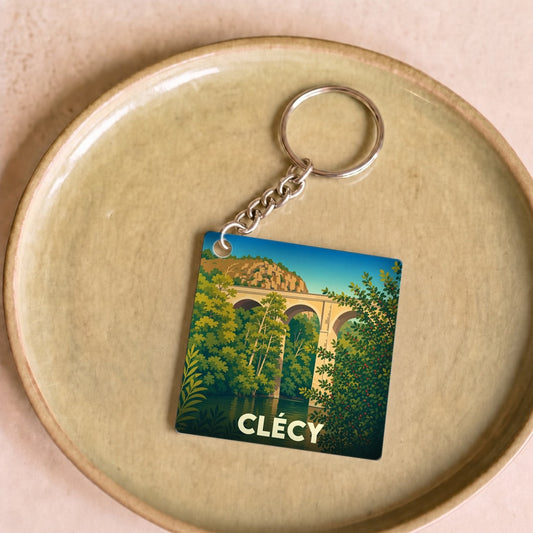 Porte-clés souvenir de la ville de Clécy avec une illustration stylisée de son viaduc.
