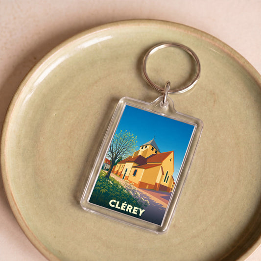 Porte-clés souvenir de la ville de Clérey avec une illustration stylisée de son église.