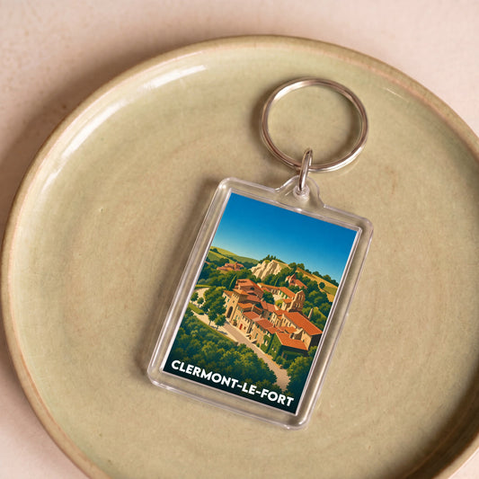 Porte-clés souvenir de la ville de Clermont-le-Fort avec une illustration stylisée du village.