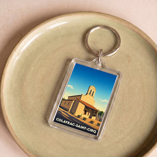 Porte-clés souvenir de la ville de Colayrac-Saint-Cirq avec une illustration stylisée d'une église.