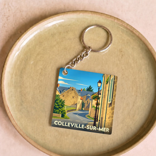 Porte-clés souvenir de la ville de Colleville-sur-Mer avec une illustration stylisée.