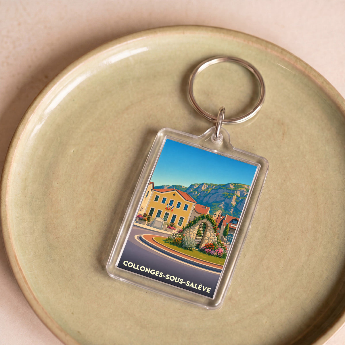 Porte-clés souvenir de la ville de Collonges-sous-Salève avec une illustration stylisée.