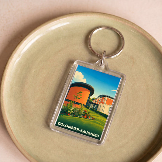 Porte-clés souvenir de la ville de Colombier-Saugnieu avec une illustration stylisée.