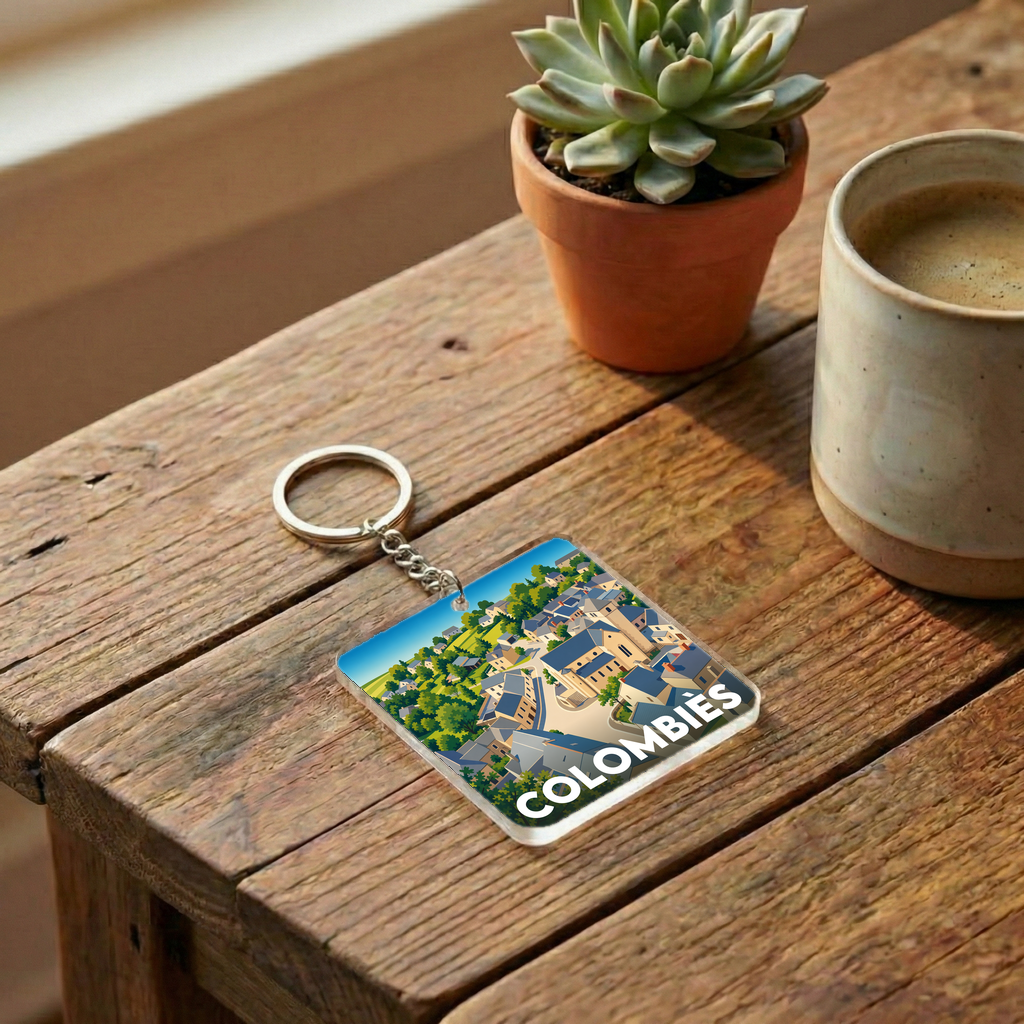 Porte-clés souvenir de la ville de Colombiès avec une illustration stylisée du village.