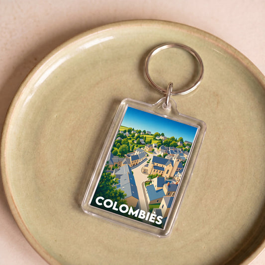 Porte-clés souvenir de la ville de Colombiès avec une illustration stylisée du village.