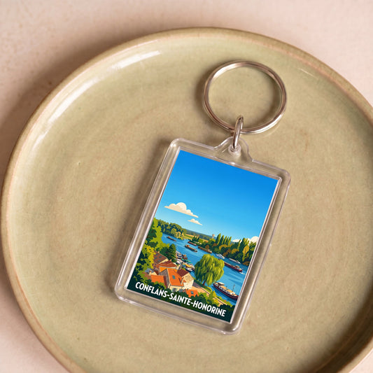 Porte-clés souvenir de la ville de Conflans-Sainte-Honorine avec une illustration stylisée de ses bords de rivière.