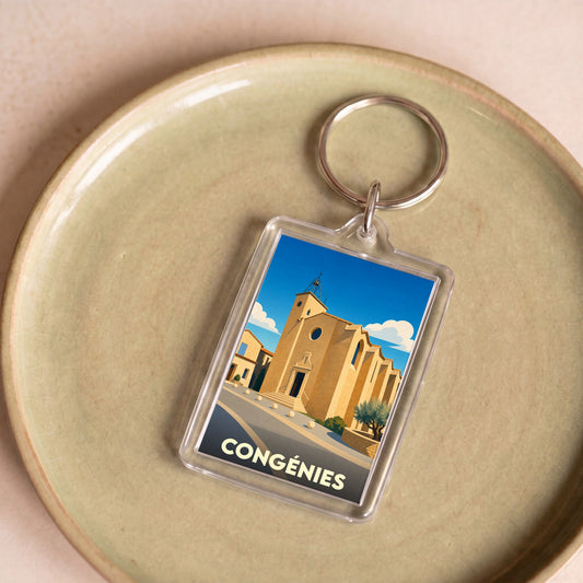 Porte-clés souvenir de la ville de Congénies avec une illustration stylisée de son église.