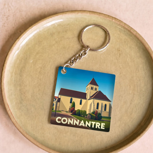 Porte-clés souvenir de la ville de Connantre avec une illustration stylisée de son église.