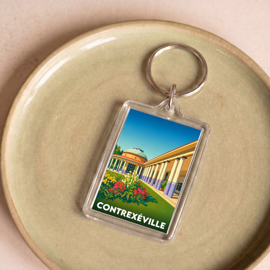 Porte-clés souvenir de la ville de Contrexéville avec une illustration stylisée.