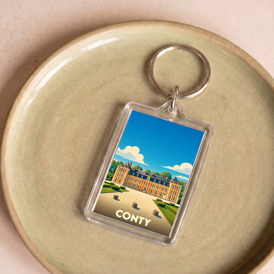 Porte-clés souvenir de la ville de Conty avec une illustration stylisée de son château.