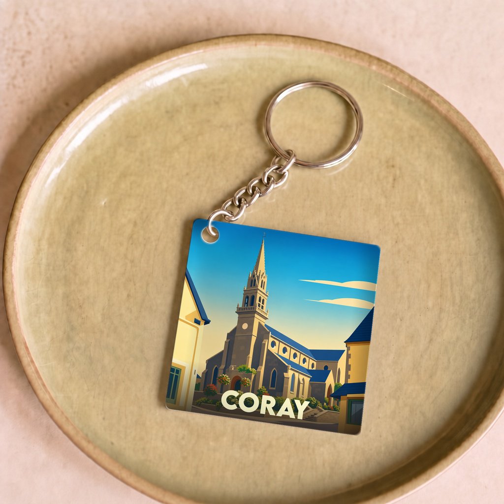 Porte-clés souvenir de la ville de Coray avec une illustration stylisée de son église.