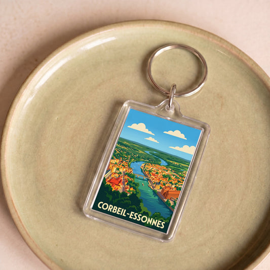 Porte-clés souvenir de la ville de Corbeil-Essonnes avec une illustration stylisée.