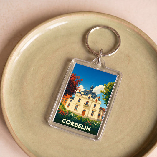 Porte-clés souvenir de la ville de Corbelin avec une illustration stylisée de son patrimoine.