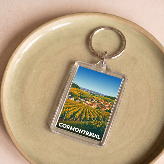 Porte-clés souvenir de la ville de Cormontreuil avec une illustration stylisée de vignobles.