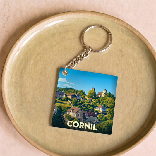 Porte-clés souvenir de la ville de Cornil avec une illustration stylisée.