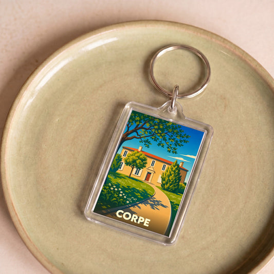 Porte-clés souvenir de la ville de Corpe avec une illustration stylisée.
