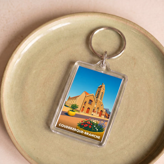 Porte-clés souvenir de la ville de Coudekerque-Branche avec une illustration stylisée.