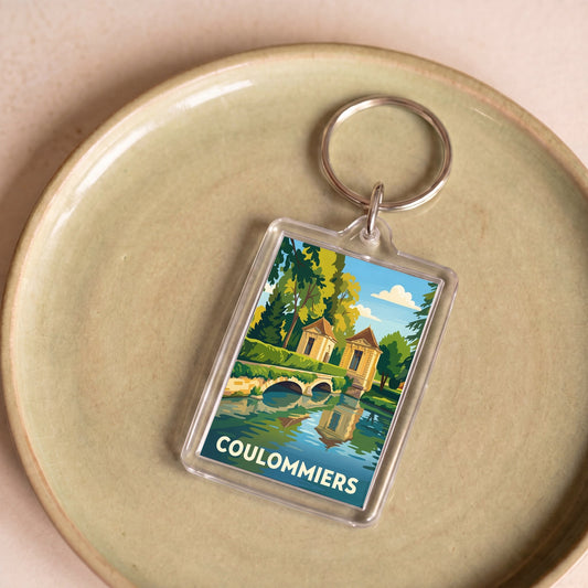 Porte-clés souvenir de la ville de Coulommiers avec une illustration stylisée.