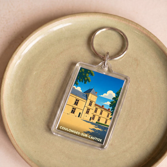 Porte-clés souvenir de la ville de Coulonges-sur-l'Autize avec une illustration stylisée de son château.