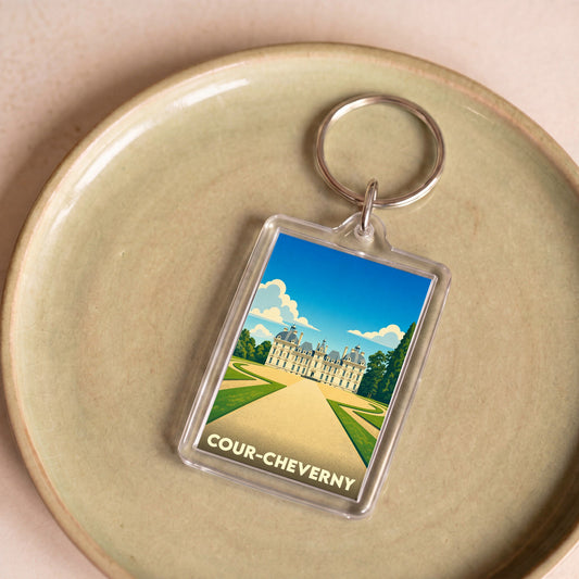 Porte-clés souvenir de la ville de Cour-Cheverny avec une illustration stylisée de son château.