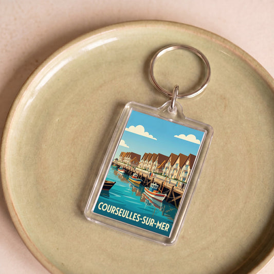 Porte-clés souvenir de la ville de Courseulles-sur-Mer avec une illustration stylisée.