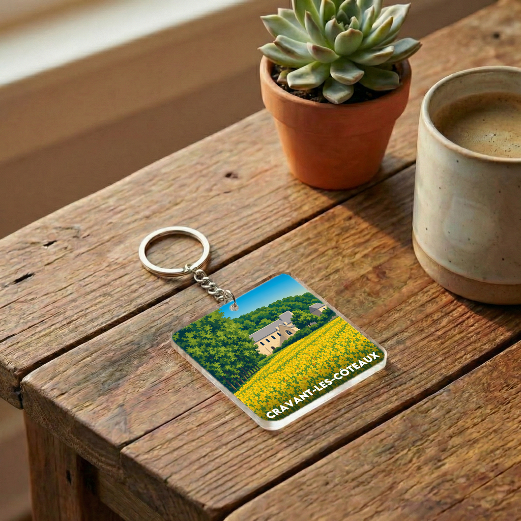 Porte-clés souvenir de la ville de Cravant-les-Côteaux avec une illustration stylisée.