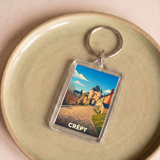 Porte-clés souvenir de la ville de Crépy avec une illustration stylisée.