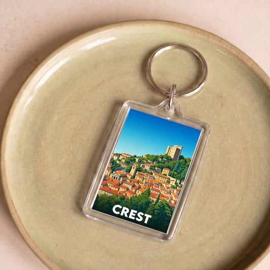 Porte-clés souvenir de la ville de Crest avec une illustration stylisée.