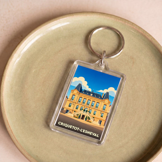 Porte-clés souvenir de la ville de Criquetot-l'Esneval avec une illustration stylisée.