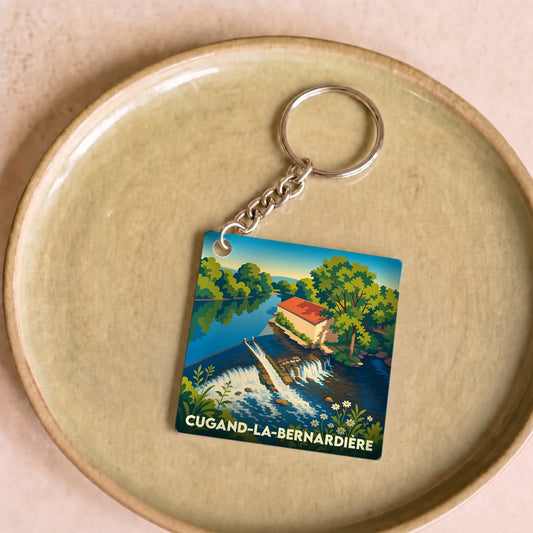 Porte-clés souvenir de Cugand-la-Bernardière avec une illustration stylisée de son moulin et de la rivière.
