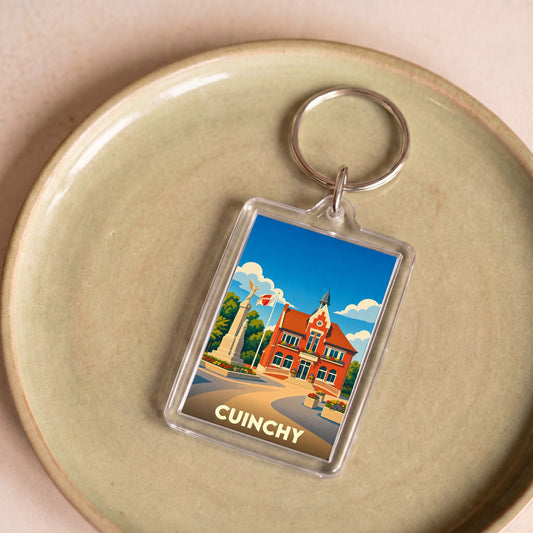 Porte-clés souvenir de la ville de Cuinchy avec une illustration stylisée.