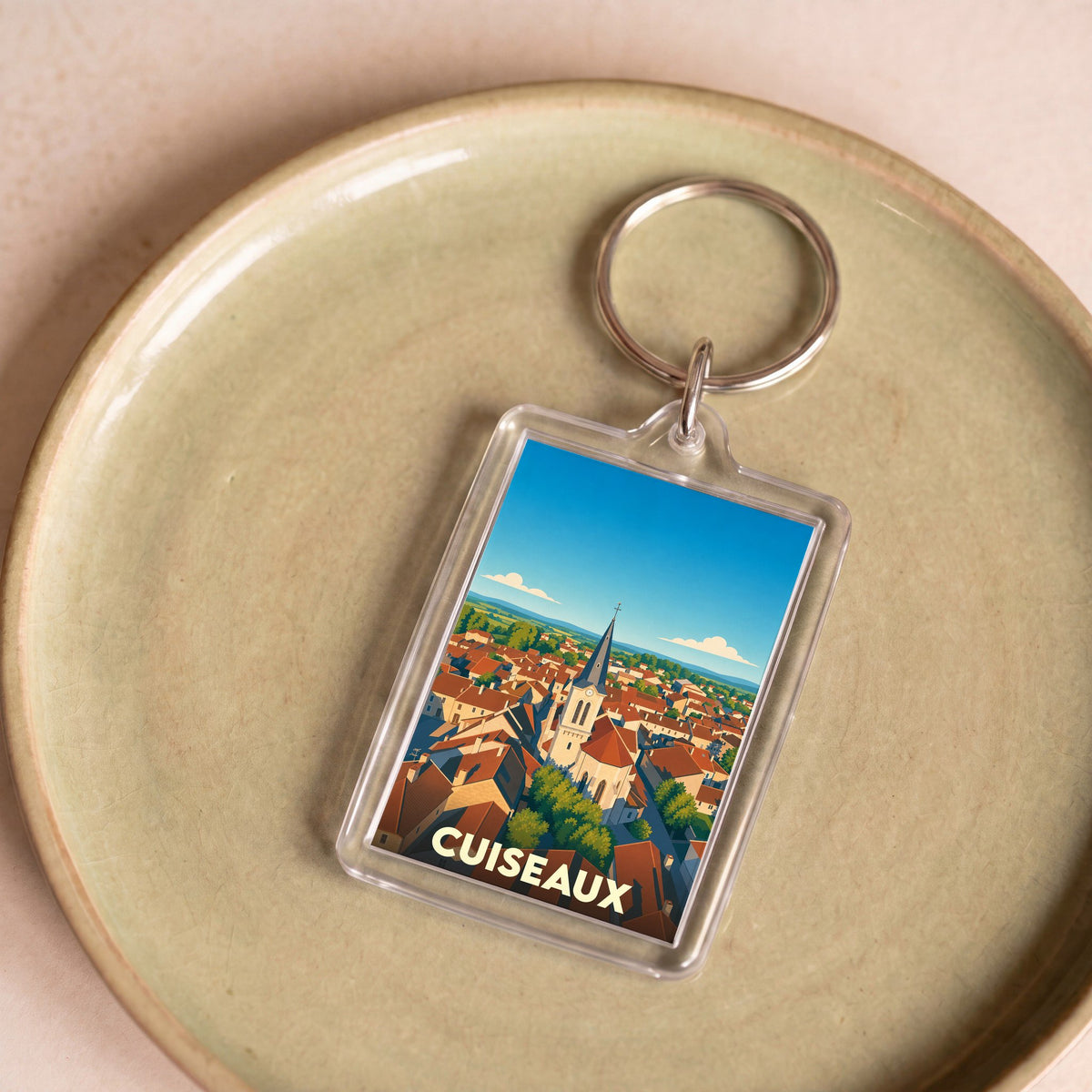 Porte-clés souvenir de la ville de Cuiseaux avec une illustration stylisée.