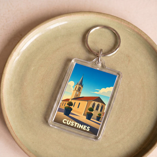 Porte-clés souvenir de la ville de Custines avec une illustration stylisée de son église.