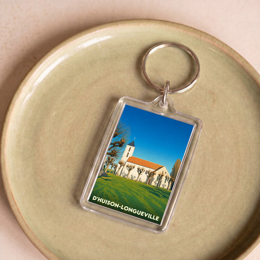 Porte-clés souvenir de la ville de D'Huison-Longueville avec une illustration stylisée.