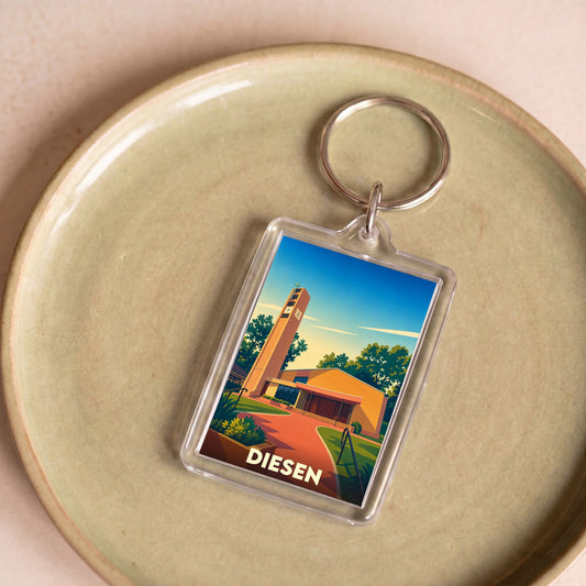 Porte-clés souvenir de la ville de Diesen avec une illustration stylisée de son église.