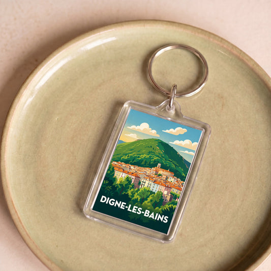 Porte-clés souvenir de la ville de Digne-les-Bains avec une illustration stylisée.