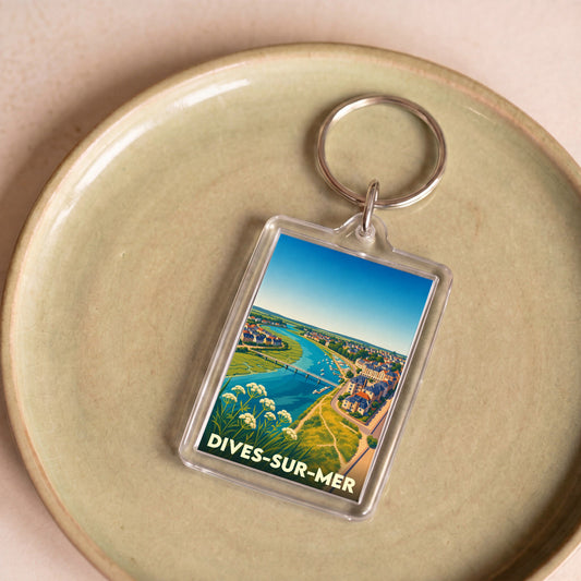 Porte-clés souvenir de la ville de Dives-sur-Mer avec une illustration panoramique stylisée.