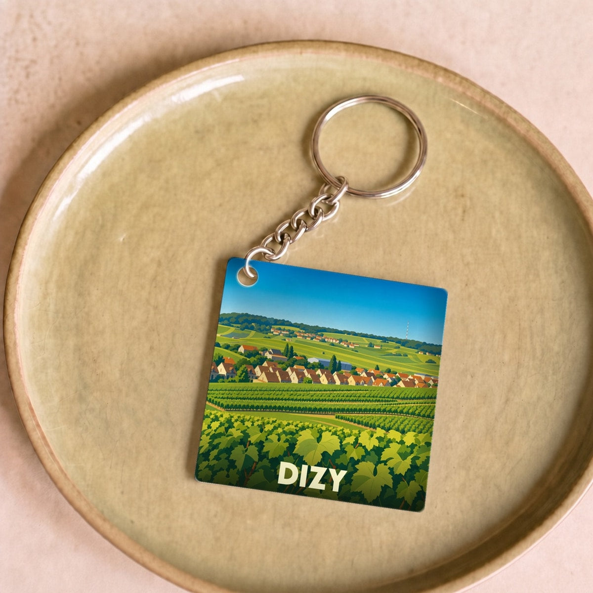 Porte-clés souvenir de la ville de Dizy avec une illustration stylisée de son vignoble.