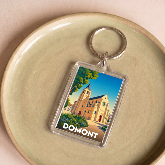 Porte-clés souvenir de la ville de Domont avec une illustration stylisée.